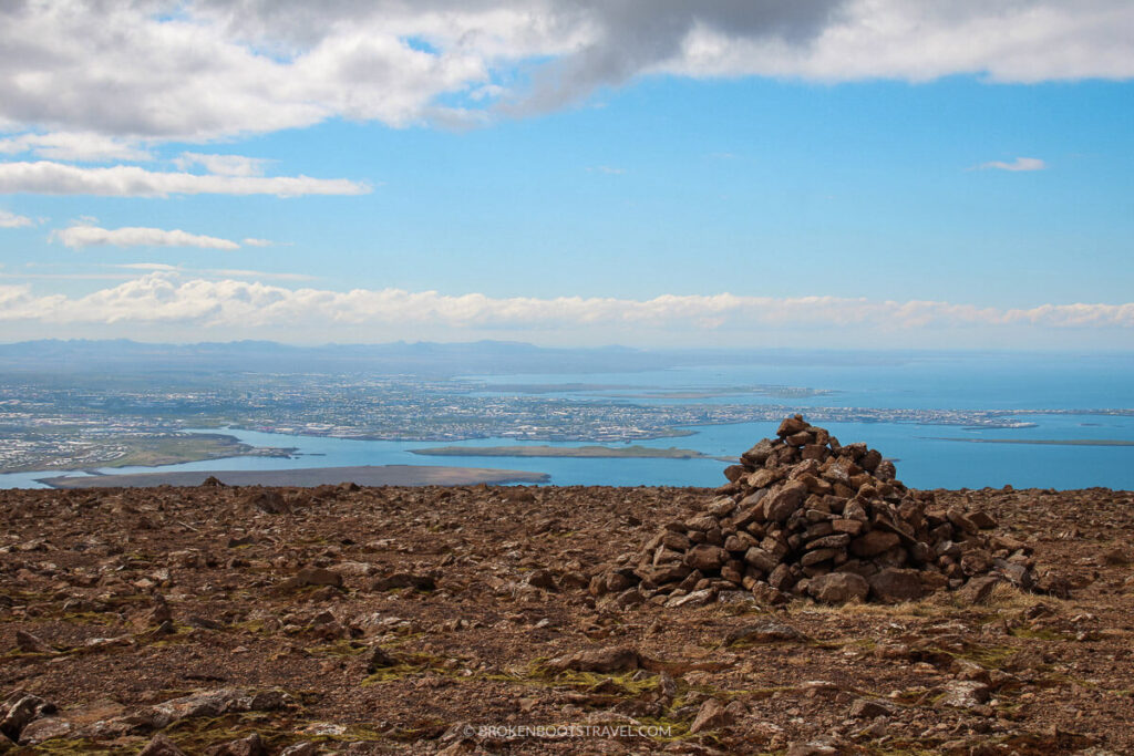 Rock pile on the summit of Mount Esja with views of Reykjavik