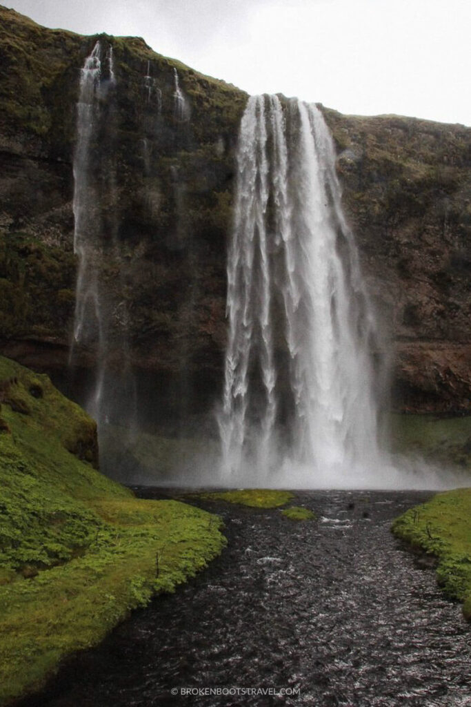 Walk behind Seljalandsfoss Waterfall in Iceland