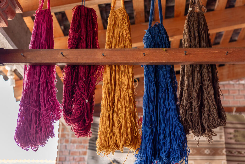 Multicolored dyed yarn hangs from the ceiling in Teotitlán del Valle