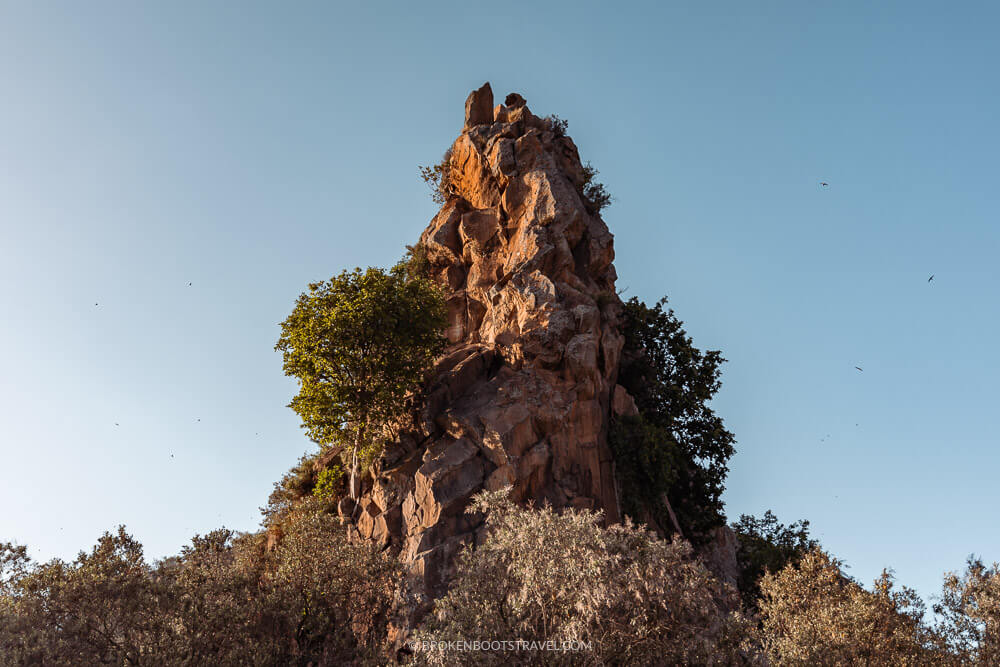 Large rock structure against blue sky