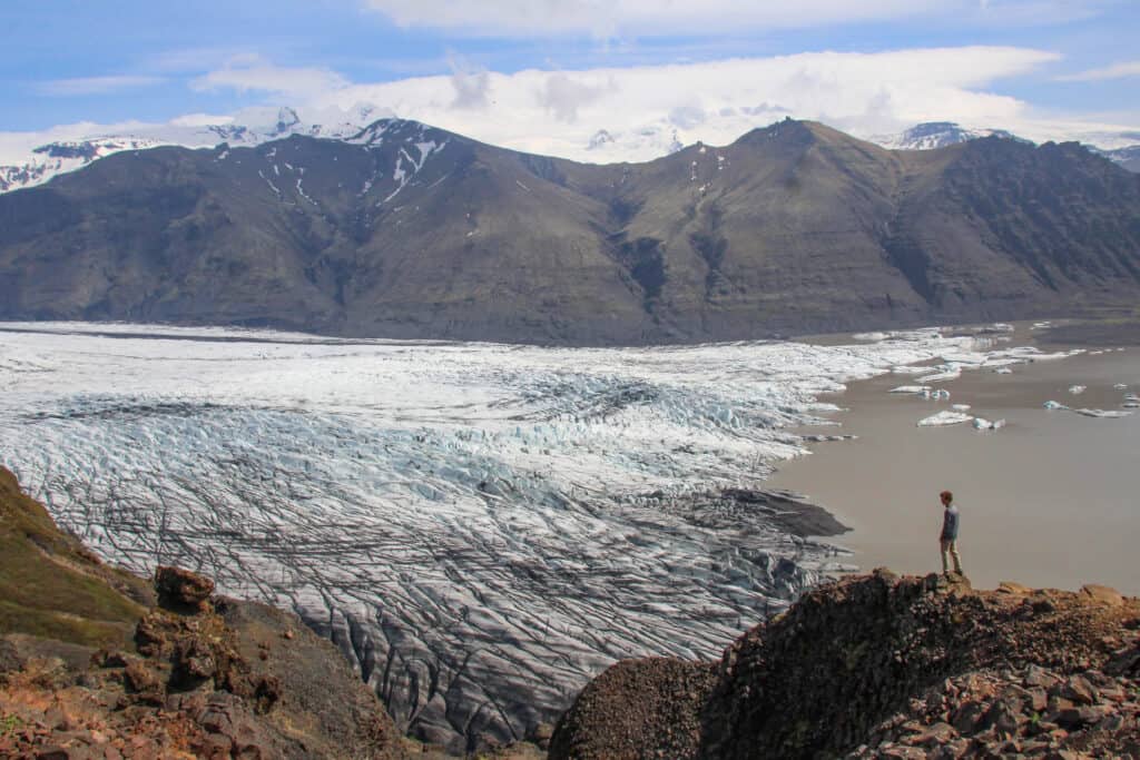 Man overlooking a glacier at Vatnajökull National Park, Iceland