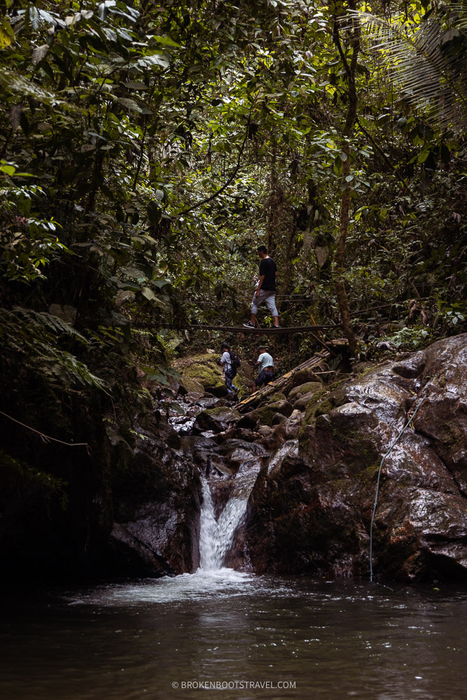 People swimming in a small waterfall at Santa Rita la Cascada