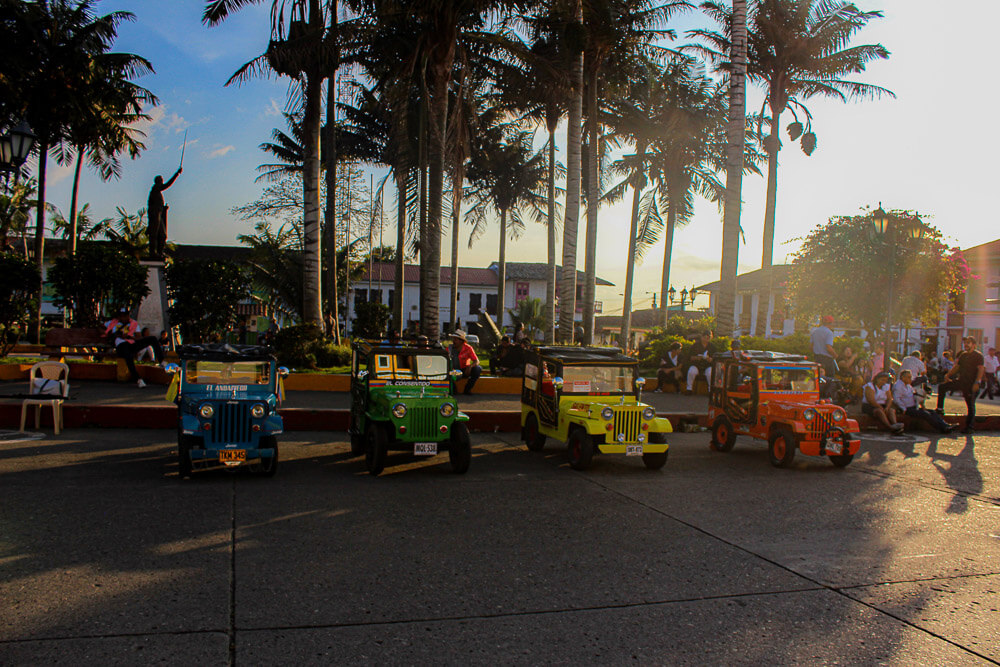 Jeep Willys lined up at Plaza Bolivar in Salento Colombia