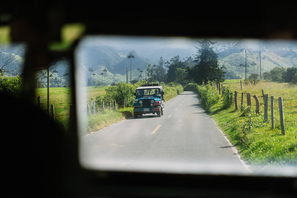 Jeep Willy driving down a road in the Cocora Valley, Colombia