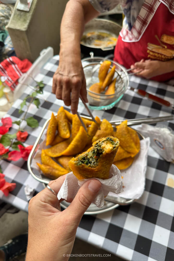 Hand holding an empanada