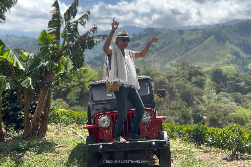 Man dancing on a Jeep Willy in Colombian coffee region