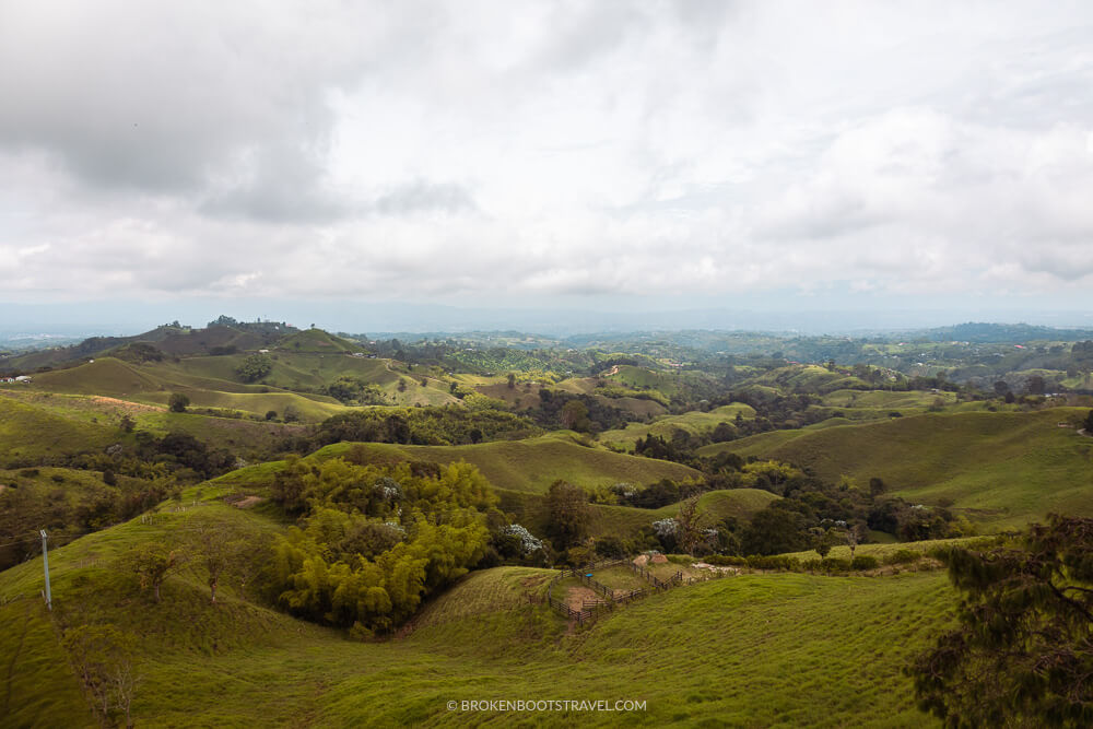 Green rolling hills with coffee farms in Colombia's Coffee Region