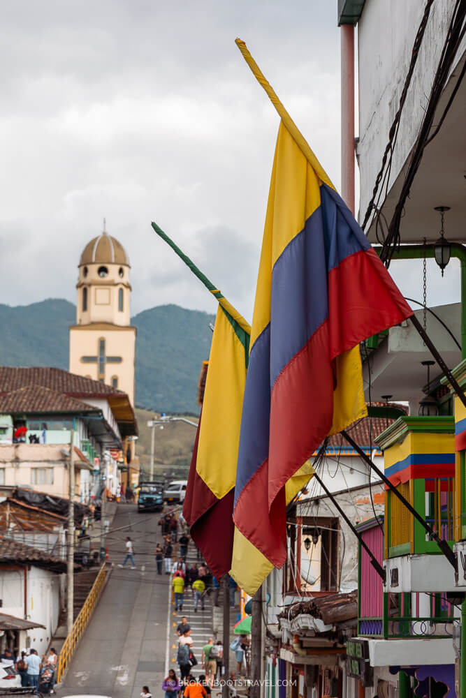 View of the cathedral in Salento, Colombia with Colombian flag