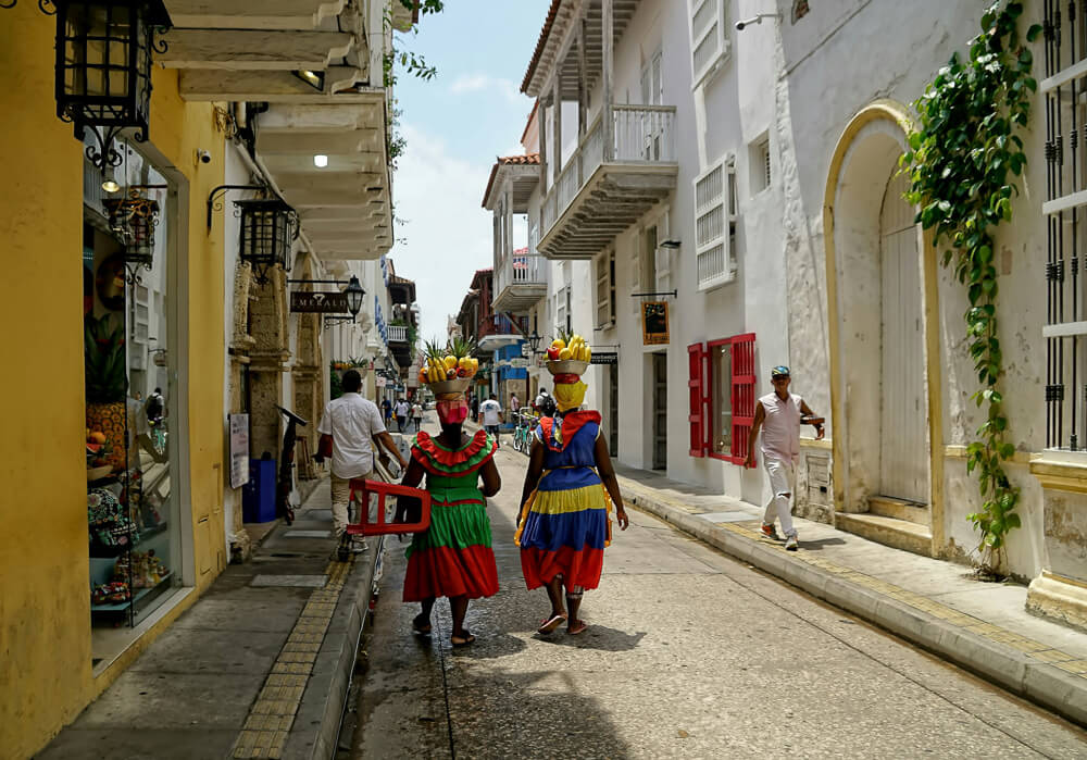 Palenqueras walking down the street in Cartagena, Colombia