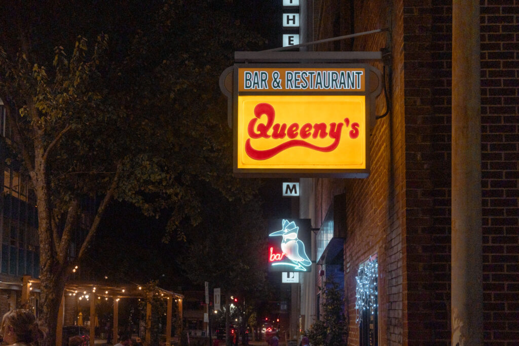 Sign for Queeny's Bar and Restaurant in Downtown Durham, North Carolina