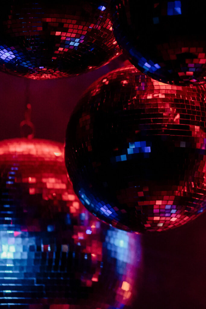 Disco balls reflecting blue and red light