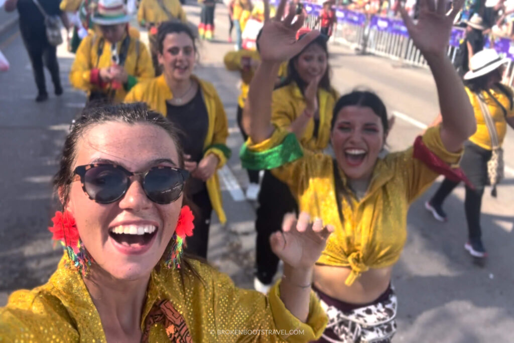 Girls in yellow shirts smiling in Barranquilla Carnival celebrations