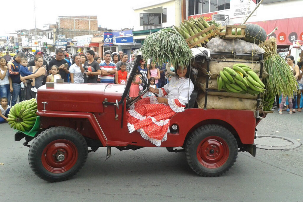 Women in a red jeep willy for Yipao parade