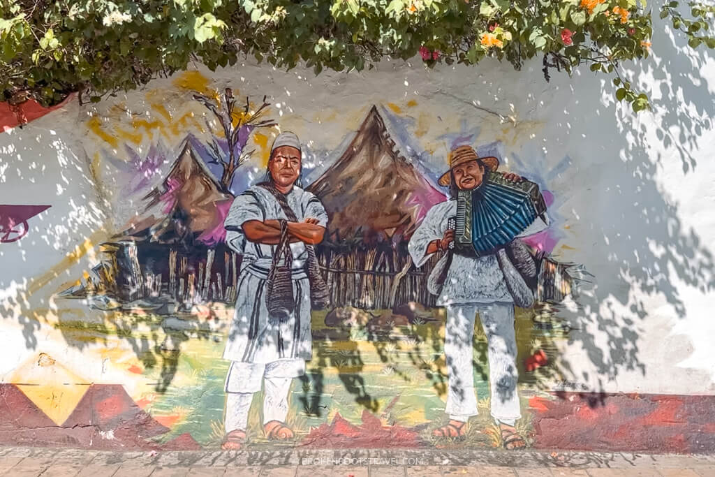 Mural of indigenous men in Sierra Nevada playing accordion