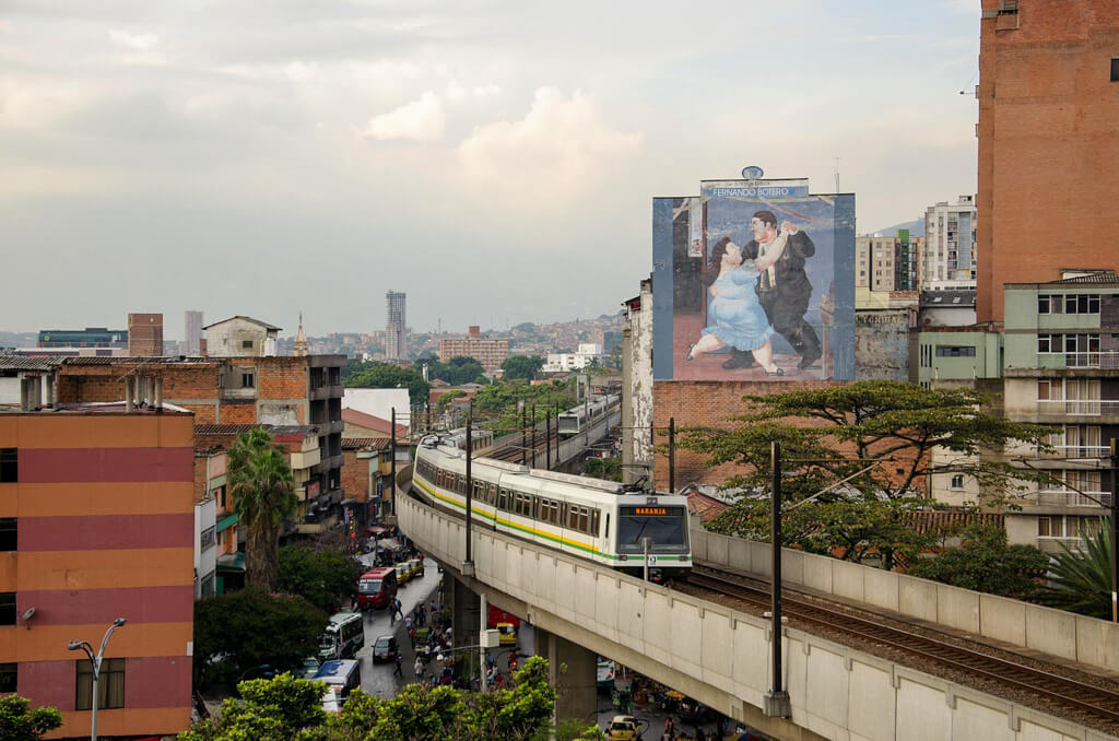 Skyline of Medellin Colombia with metro in the foreground