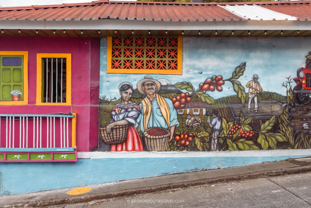 Mural of coffee farmers on a wall of a building in Colombia