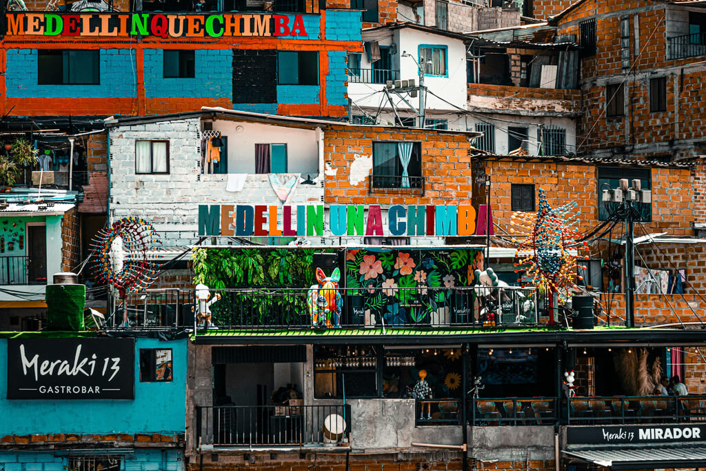 Neighborhood in Medellín, Colombia with large sign reading "Medellin una chimba"