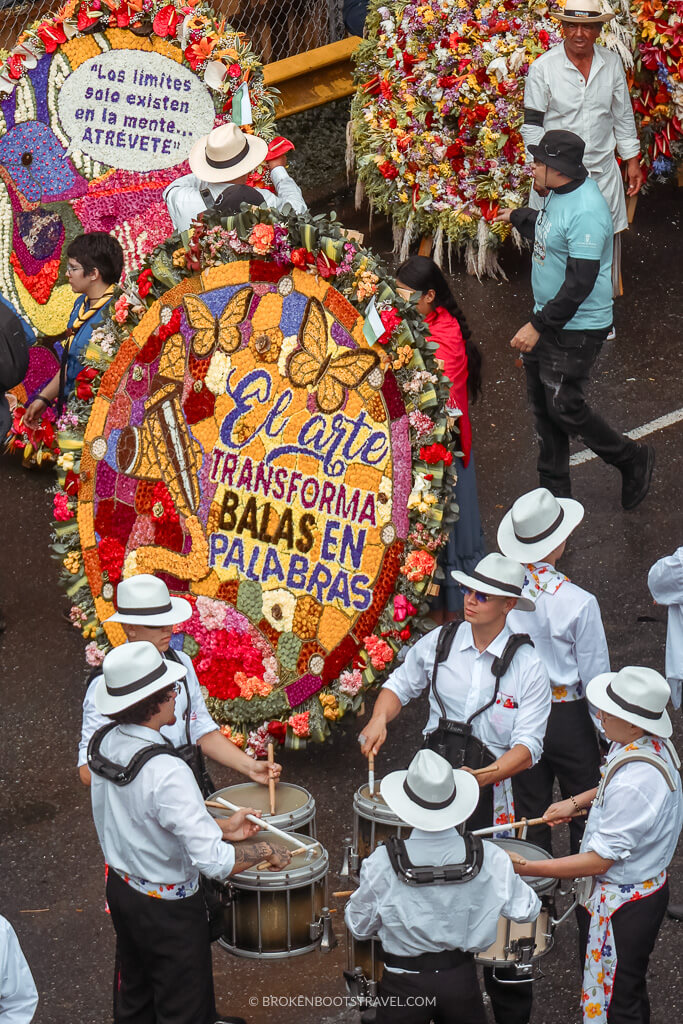 Silleros carry silletas down the street at the Feria de Flores
