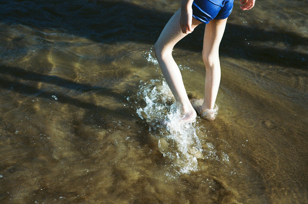 Feet splashing in a puddle
