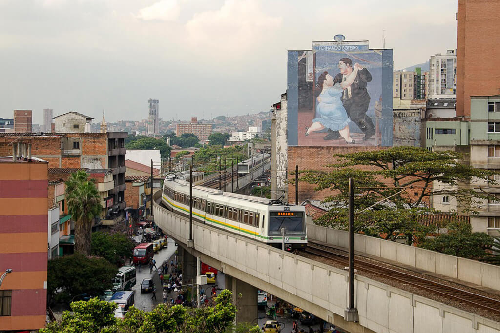 Skyline of Medellin, Colombia with metro driving by