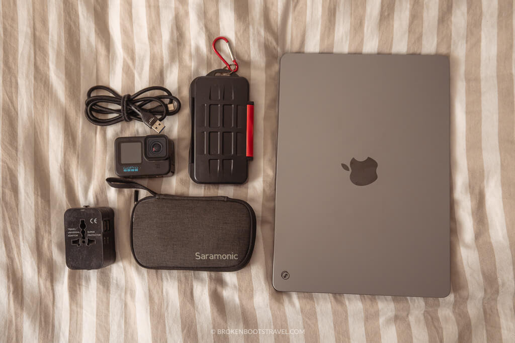 Electronics laid out on a striped blanket
