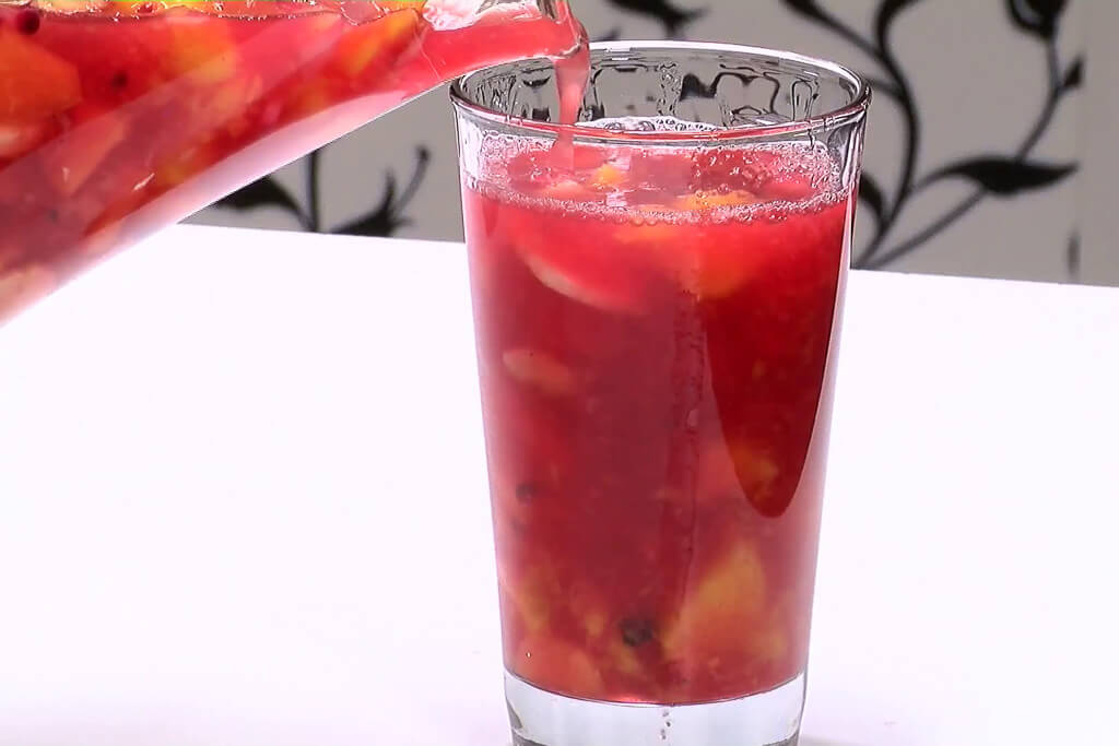 Serving salpicón in a glass, Colombian dessert