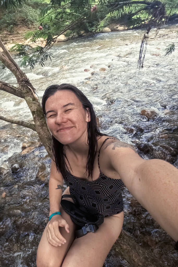 Girl in brown bathing suit taking a selfie in San Rafael, Colombia