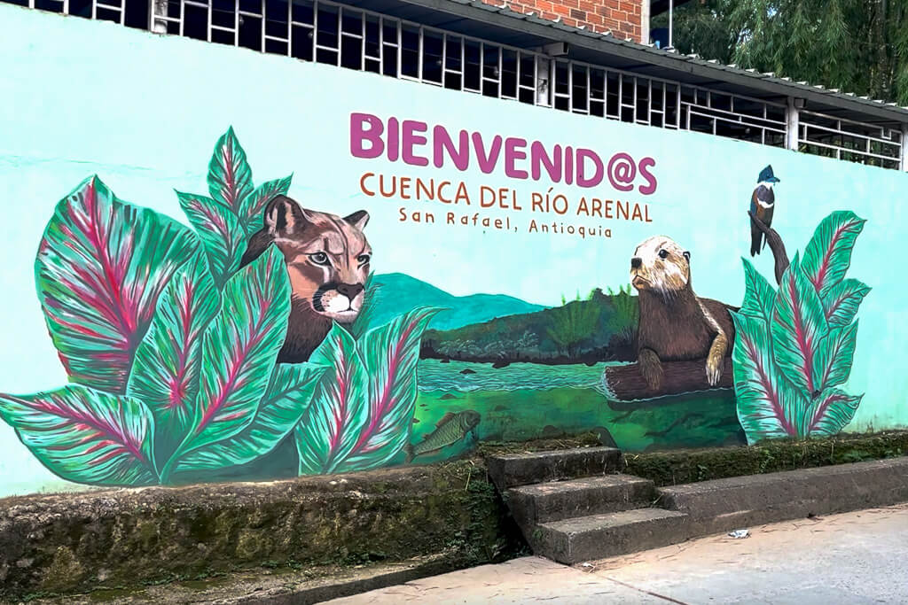 Painted mural showing flora and fauna of San Rafael, Colombia