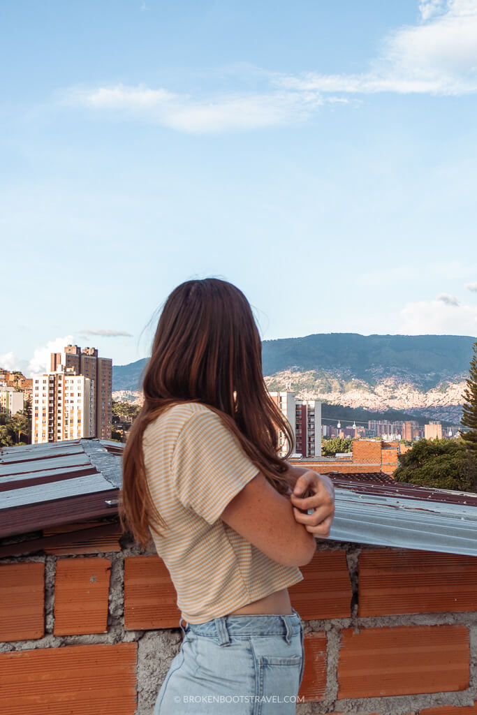 Girl in yellow shirt overlooking San Javier skyline in Medellín, Colombia