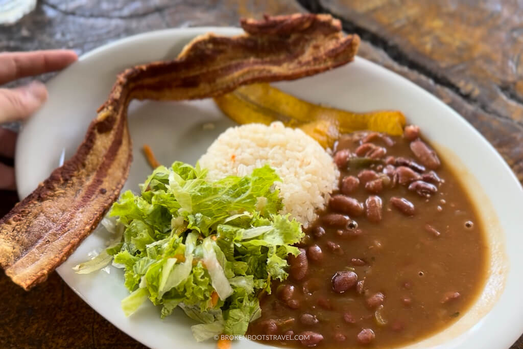 Chicharron with beans, rice, and salad