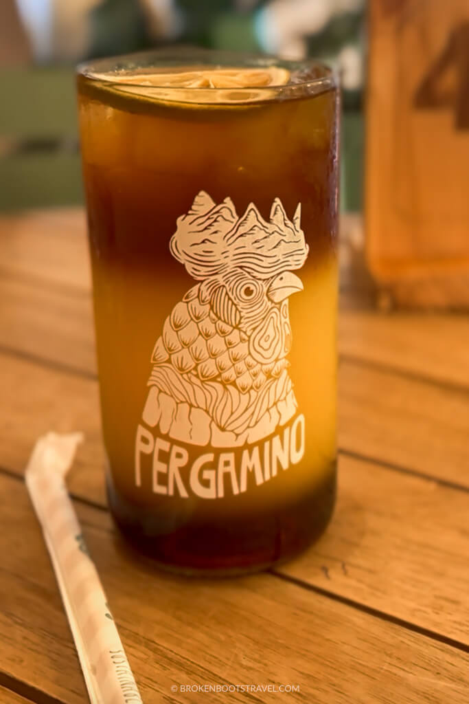 Cup of coffee and orange juice with a chicken on the front, Pergamino, Medellín, Colombia