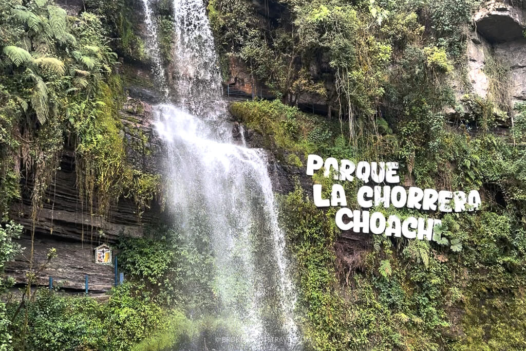 Waterfall with sign reading Parque La Chorrera day trip from Bogotá