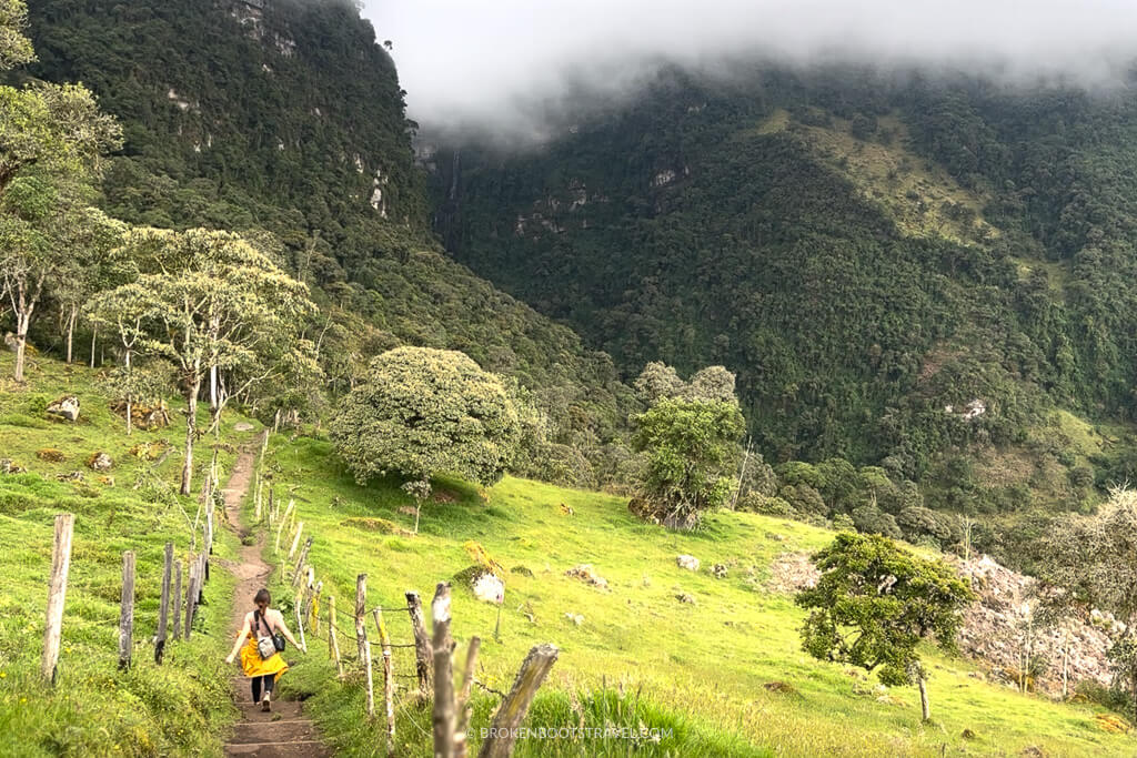Girl in yellow jacket visiting Cascada La Chorrera